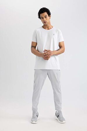 DeFactoFit Sporcu Jogger Eşofman Altı Slim Fit Dar Kesim Çift Cepli Standart Paça Dokuma B5157AX24SPGR91