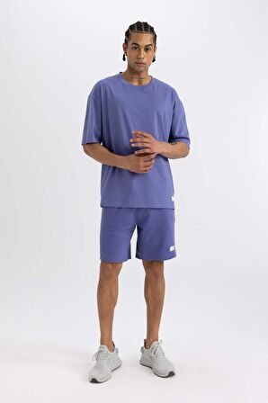 DeFactoFit Slim Fit Dar Kesim Cepli Baskılı Sporcu Şort A1625AX24SMPR484