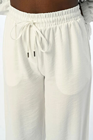 KADIN BELİ LASTİKLİ RAHAT KALIP BOL PAÇA DÜZ RENK PANTOLON