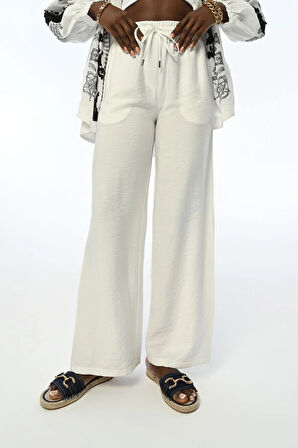 KADIN BELİ LASTİKLİ RAHAT KALIP BOL PAÇA DÜZ RENK PANTOLON