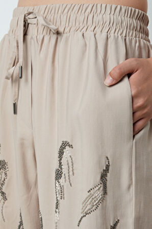 Kadın Önü Taş İşlemeli Düz Renk Beli Lastikli Bol Paça Pantolon