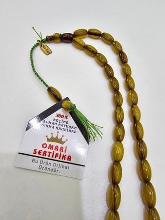 Omari İmzalı Sertifikalı Alman Faturan Sıkma Kehribar Tesbih 7x12 mm Arpa Kesim