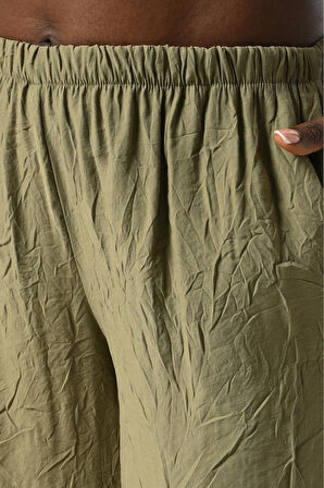 KADIN BELİ LASTİKLİ BOL PAÇA KIRIŞIK KUMAŞ DÜZ RENK PANTOLON