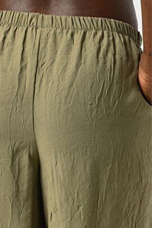 KADIN BELİ LASTİKLİ BOL PAÇA KIRIŞIK KUMAŞ DÜZ RENK PANTOLON