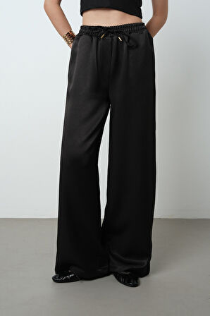 Kadın Düz Renk Parlak Kumaş Bol Paça Beli Lastikli Pantolon