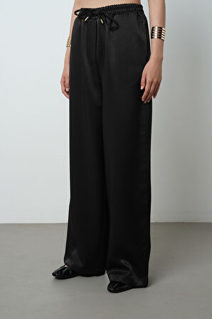 Kadın Düz Renk Parlak Kumaş Bol Paça Beli Lastikli Pantolon