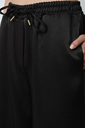 Kadın Düz Renk Parlak Kumaş Bol Paça Beli Lastikli Pantolon