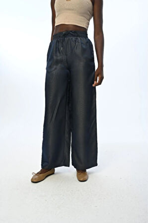 KADIN BELİ LASTİKLİ BOL PAÇA PARLAK KUMAŞ DÜZ RENK PANTOLON