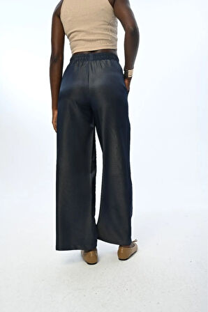 KADIN BELİ LASTİKLİ BOL PAÇA PARLAK KUMAŞ DÜZ RENK PANTOLON