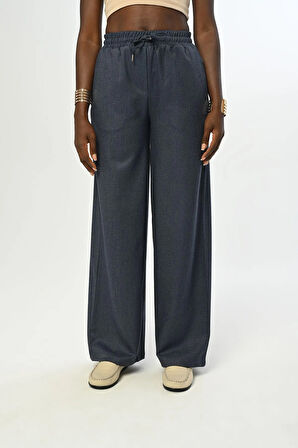 KADIN BELİ LASTİKLİ BOL PAÇA SİMLİ DÜZ RENK PANTOLON