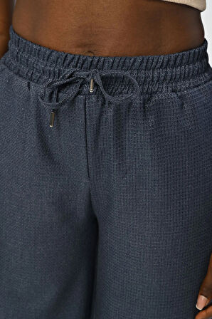 KADIN BELİ LASTİKLİ BOL PAÇA SİMLİ DÜZ RENK PANTOLON