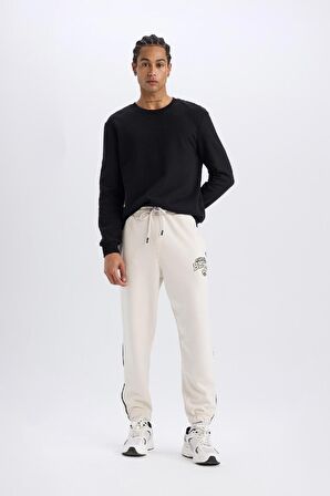 DeFactoFit NBA Milwaukee Bucks Jogger Eşofman Altı Standart Fit Cepli Esnek Bantlı Paça Skuba Dalgıç Kumaş D6725AX25SPBG662