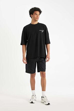 DeFacto Siyah Loose Fit Bisiklet Yaka Sırt Baskılı Pamuklu Kısa Kollu Tişört B8949AX24AUBK81