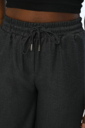 KADIN BELİ LASTİKLİ BOL PAÇA SİMLİ DÜZ RENK PANTOLON