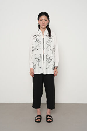 KADIN ÖNÜ BONCUK İŞLEMELİ OVERSİZE KESİM DÜZ RENK GÖMLEK