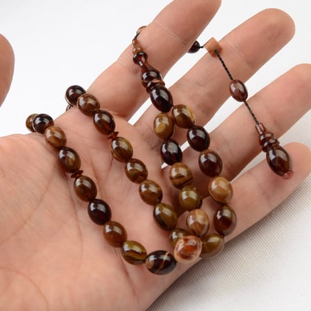 Beyzi Kesim 11X8 mm Hareli Sıkma Kehribar Sistem Püsküllü Tesbih