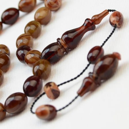 Beyzi Kesim 11X8 mm Hareli Sıkma Kehribar Sistem Püsküllü Tesbih