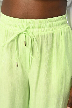 KADIN BELİ LASTİKLİ BOL PAÇA İNCE ÇİZGİLİ DÜZ RENK PANTOLON