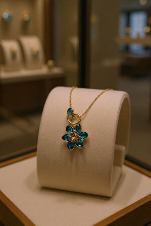 Altın Renk Taşlı Çiçek Figürlü Çelik Kolye