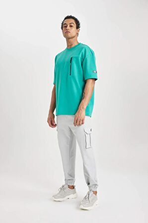 DeFactoFit Sporcu Jogger Eşofman Altı Standart Fit Kargo Cepli Dokuma Beli Paçası Lastikli C0043AX24SPBG143