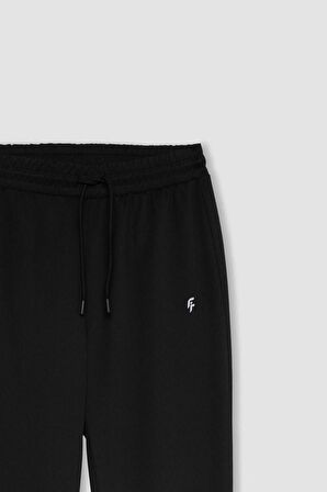 DeFactoFit Standart Fit Çift Cepli Paçası Lastikli Standart Boy Sporcu Eşofman Altı A4557AX24SPBK81