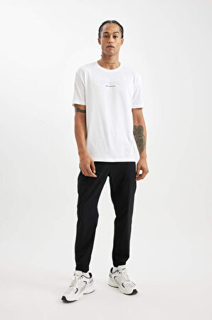 DeFactoFit Dokuma Esnek Multifonksiyonel Sporcu Jogger Eşofman Altı Slim Fit Dar Kesim Çift Cepli C1212AX24AUBK81