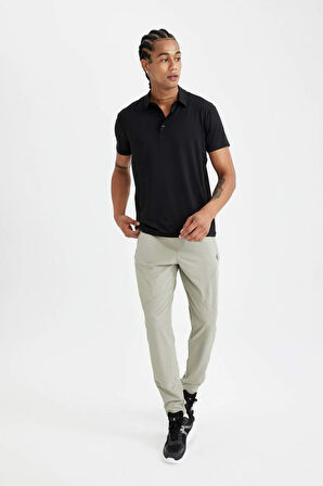 DeFactoFit Sporcu Dokuma Pantolon Slim Fit Dar Kesim Çift Cepli Fermuarlı Paça C9262AX24AUKH418