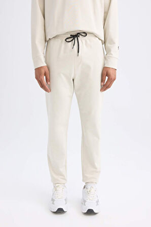 DeFactoFit Sporcu Jogger Eşofman Altı Slim Fit Dar Kesim Standart Paça Beli Paçası Lastikli D6831AX24AUBG721