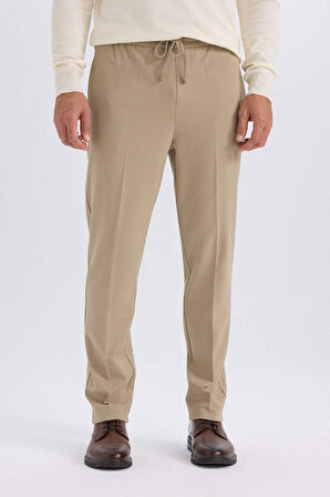 DeFacto Yazlık Kumaş Jogger Pantolon Beli Bağcıklı Lastikli Düz Paça Cepli Her Yöne Esneyen A9943AX25SPBG315