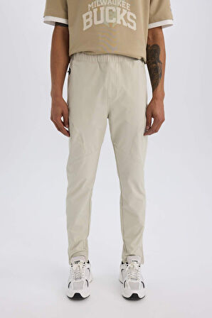 DeFactoFit Sporcu Jogger Eşofman Altı Slim Fit Dar Kesim Dokuma Üç Cepli Fermuarlı Paça B2780AX25SPBG779