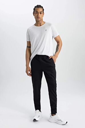 DeFactoFit Sporcu Jogger Eşofman Altı Slim Fit Dar Kesim Dokuma Üç Cepli Fermuarlı Paça B2780AX24SMBK81