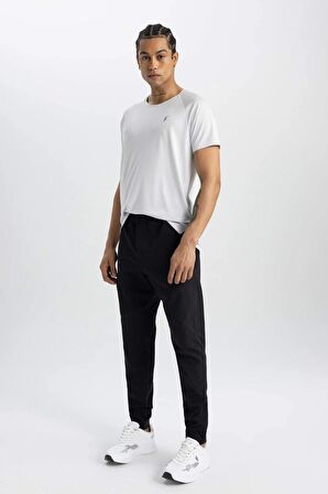 DeFactoFit Sporcu Jogger Eşofman Altı Slim Fit Dar Kesim Dokuma Üç Cepli Fermuarlı Paça B2780AX24SMBK81