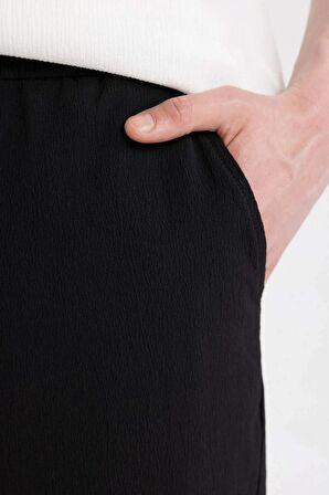 DeFacto Relax Fit Rahat Kesim Düz Paça Krinkıl Yazlık Kumaş Pantolon C3930AX24SMBK27