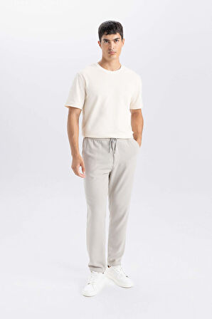 DeFacto Yazlık Jogger Pantolon Slim Fit Dar Kesim Beli Bağcıklı Cepli Düz Paça D8638AX24AUGR107