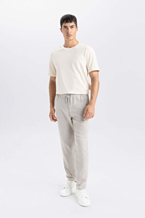 DeFacto Yazlık Jogger Pantolon Slim Fit Dar Kesim Beli Bağcıklı Cepli Düz Paça D8638AX24AUGR107