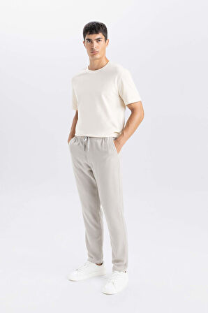 DeFacto Yazlık Jogger Pantolon Slim Fit Dar Kesim Beli Bağcıklı Cepli Düz Paça D8638AX24AUGR107