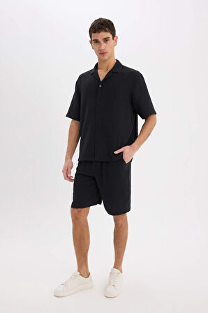 DeFacto %100 Pamuk Relax Fit Müslin Cepli Basic Düz Bermuda Şort C7589AX25SMBK81
