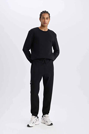 DeFactoFit NBA Brooklyn Nets Jogger Eşofman Altı Standart Fit Cepli Skuba Dalgıç Kumaş Beli Bağcıklı Lastikli Paça D8677AX25SPBK81