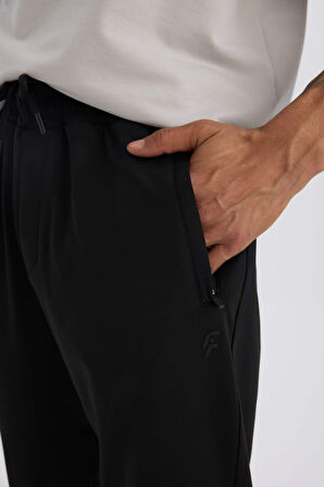 DeFactoFit Sporcu Jogger Eşofman Altı Slim Fit Dar Kesim Standart Paça Skuba Dalgıç Kumaş Beli Lastikli Düz Paça E3930AX24WNBK81
