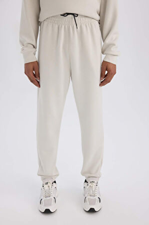 DeFactoFit Standart Fit Sporcu Jogger Eşofman Altı Skuba Dalgıç Kumaş Beli Bağcıklı Lastikli Paça D7525AX25SPBG721