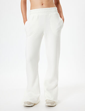 Bol Paça Eşofman Altı Beli Lastikli Yırtmaç Detaylı Yüksek Bel Şardonlu Cepli