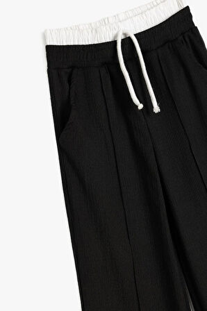 Koton Kız Çocuk Cepli Çift Bel Detaylı Beli Lastikli Basic Pantolon