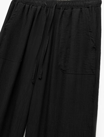 Beli Bağcıklı Geniş Paça Cepli Viskon Karışımlı Pantolon