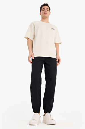 DeFacto %100 Pamuk Looney Tunes Boxy Fit Bisiklet Yaka Sırt Baskılı Kısa Kollu Tişört E9292AX25AUBG721