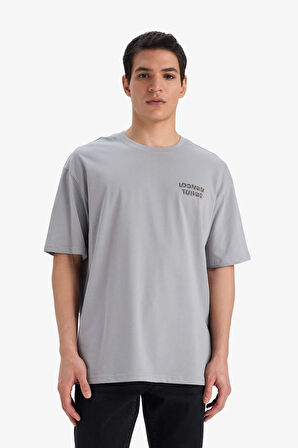 DeFacto %100 Pamuk Looney Tunes Boxy Fit Bisiklet Yaka Sırt Baskılı Kısa Kollu Tişört E9293AX25AUGR454