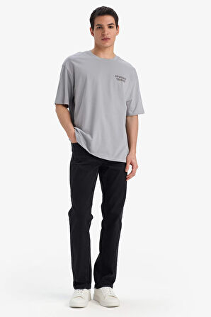 DeFacto %100 Pamuk Looney Tunes Boxy Fit Bisiklet Yaka Sırt Baskılı Kısa Kollu Tişört E9293AX25AUGR454