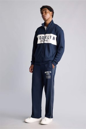 DeFacto NBA Lisanslı Brooklyn Nets Relax Fıt Skuba Dalgıç Kumaş Jogger Eşofman Altı H7758AX26AUNV253