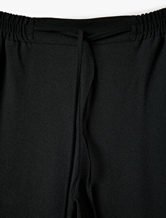 Geniş Paça Cepli Beli Bağcıklı Şerit Detaylı Pantolon