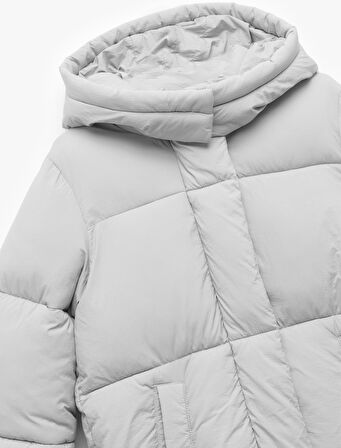 Uzun Kollu Cepli Kapitone Kapşonlu Uzun Şişme Mont