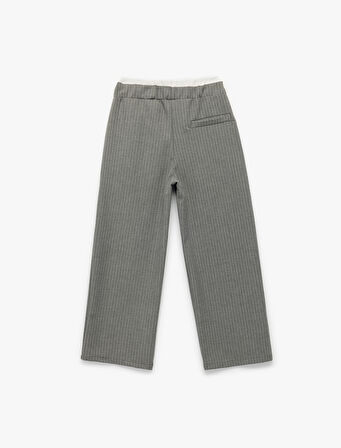 Beli Lastikli Fiyonklu Viskon Karışımlı Cep Detaylı Bol Kalıp Geniş Paça Pantolon